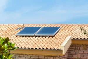 Solar pool heating collectors installed on a rooftop water heating system