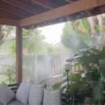 Patio misting system cooling a covered outdoor seating area