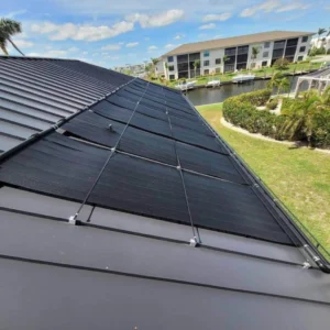 Solar pool heating panels installed on a residential metal roof