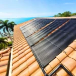Solar pool heating panels installed on a tiled residential roof